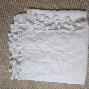 Square white scarf with pompom edges